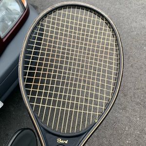 Tennis racket with cover